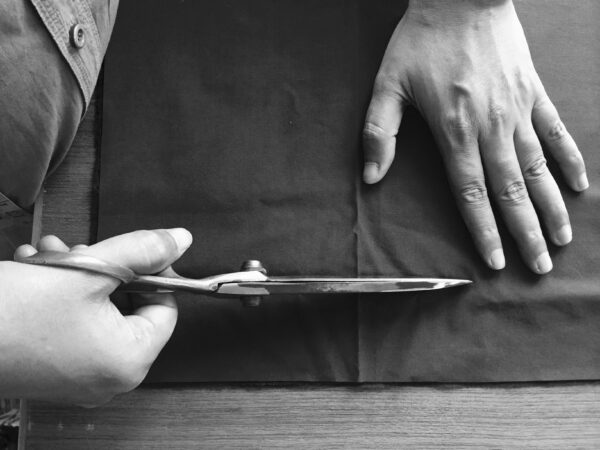 artisan cutting fabric